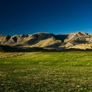 Mountain range with green meadow near Wanaka, New Zealand., Peter Wey