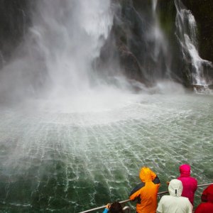 People on the boat near spectacular waterfall, Milford Sound fiord, New Zealand, Пичугин Дмитрий