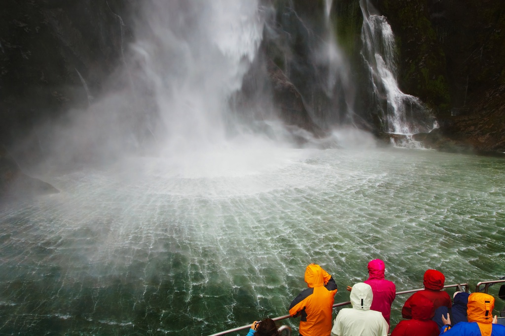 People on the boat near spectacular waterfall, Milford Sound fiord, New Zealand, Пичугин Дмитрий